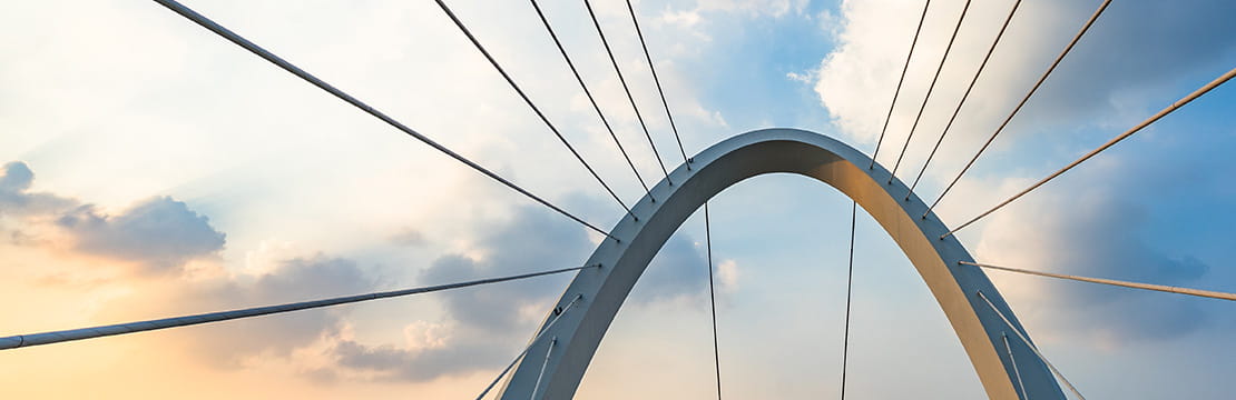 Modern bridge reflecting the stability and diversification of private credit as a retirement income strategy.